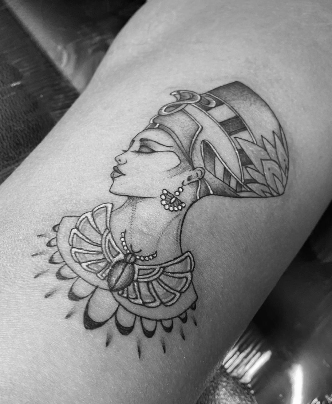 Single needle Nefertiti tattoo located on the inner